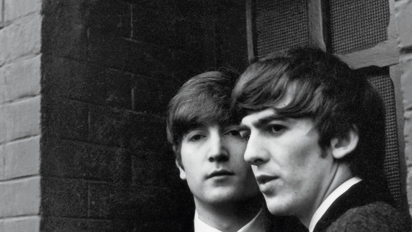 John Lennon and George Harrison Paris 1964